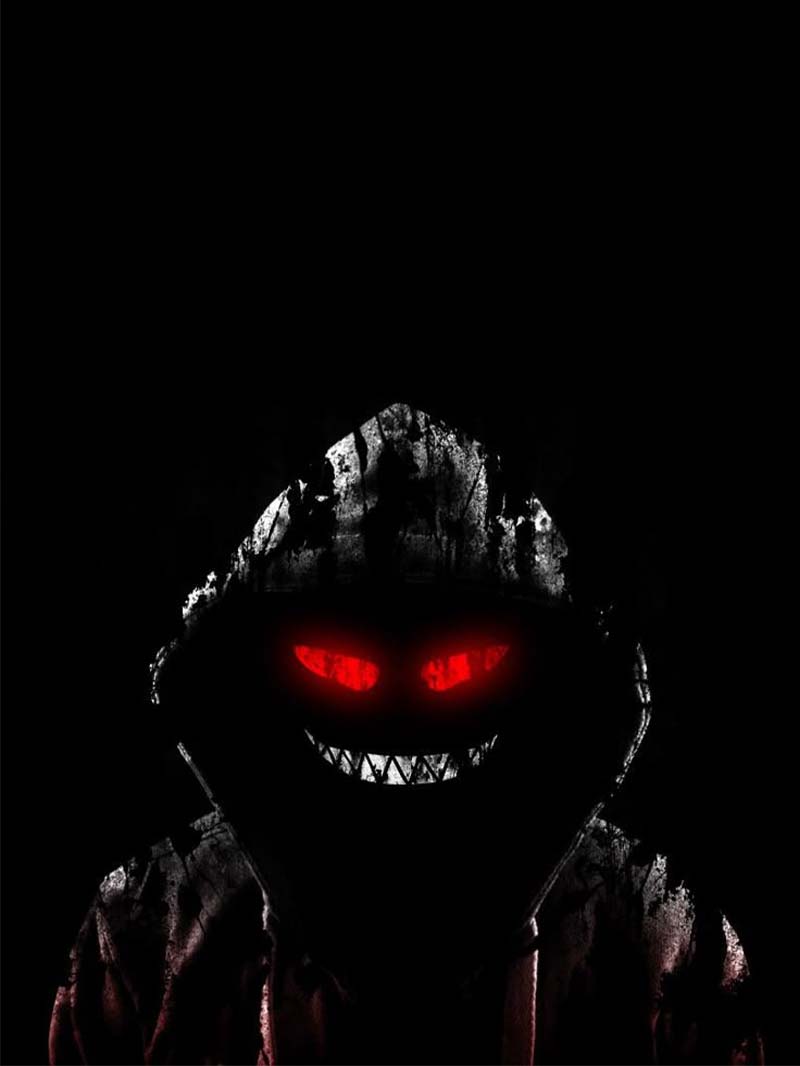 Dark Hooded Figure Scary Smile Wallpaper with Glowing Red Eyes