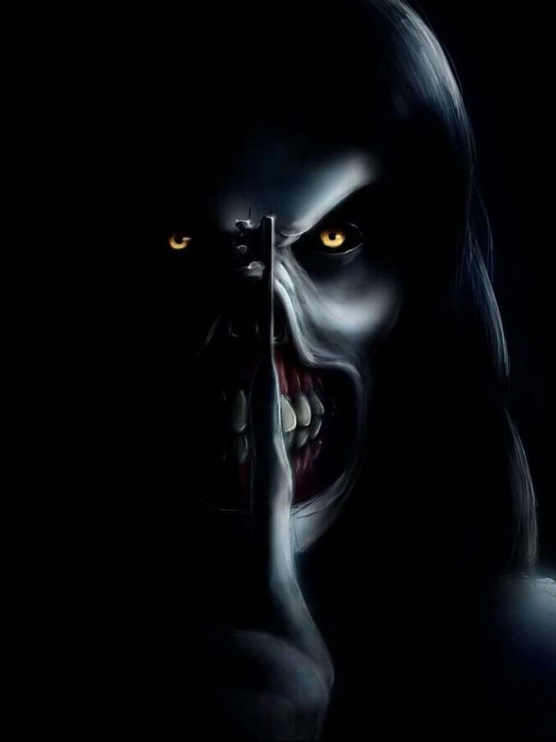Terrifying face in darkness with glowing eyes scary horror wallpaper